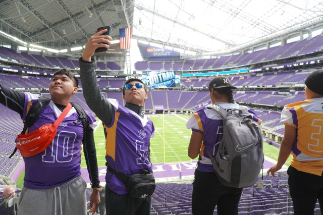 Boys take a selfie at the Vikings Stadium at the Indigenous Bowl